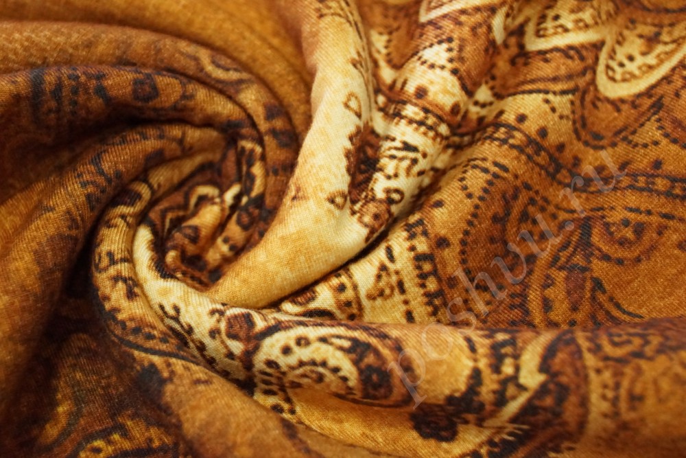 Ткань трикотаж в коричнево-желтом оттенке с орнаментом
