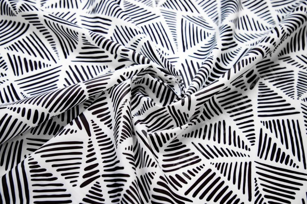 Плащевая ткань с пропиткой с рисунком "абстрактные треугольники" черно-белого цвета
