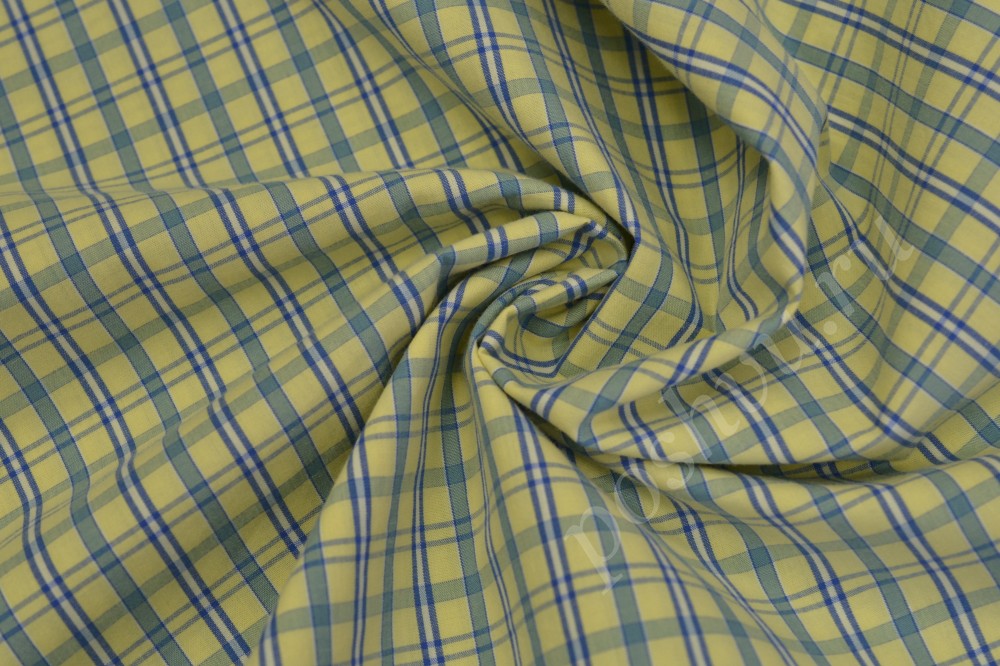 Ткань сорочечная пестротканная  желтого оттенка в синию клетку