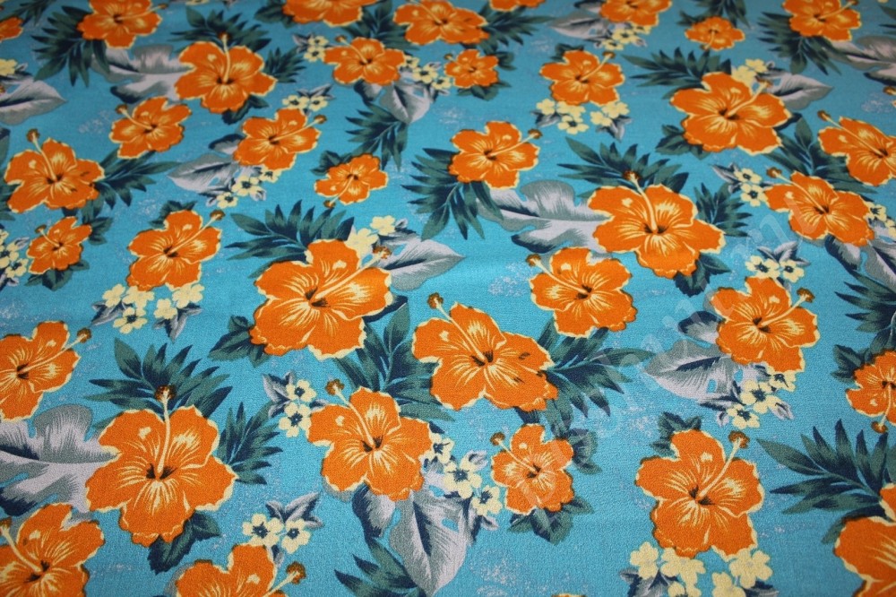 Ткань штапель голубого оттенка с яркими цветами
