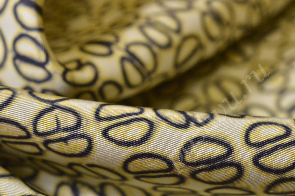 Ткань плащевая желтого оттенка с рисунком