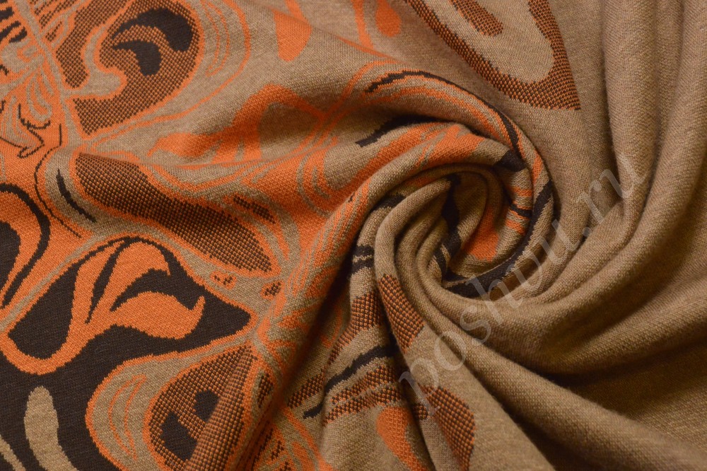 Яркая жаккардовая ткань с оранжево-коричневыми узорами