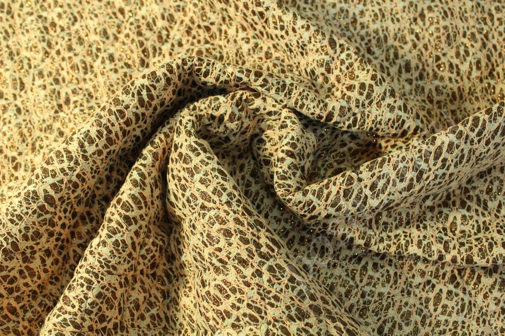 Ткань курточная золотистого цвета с имитацией кружева