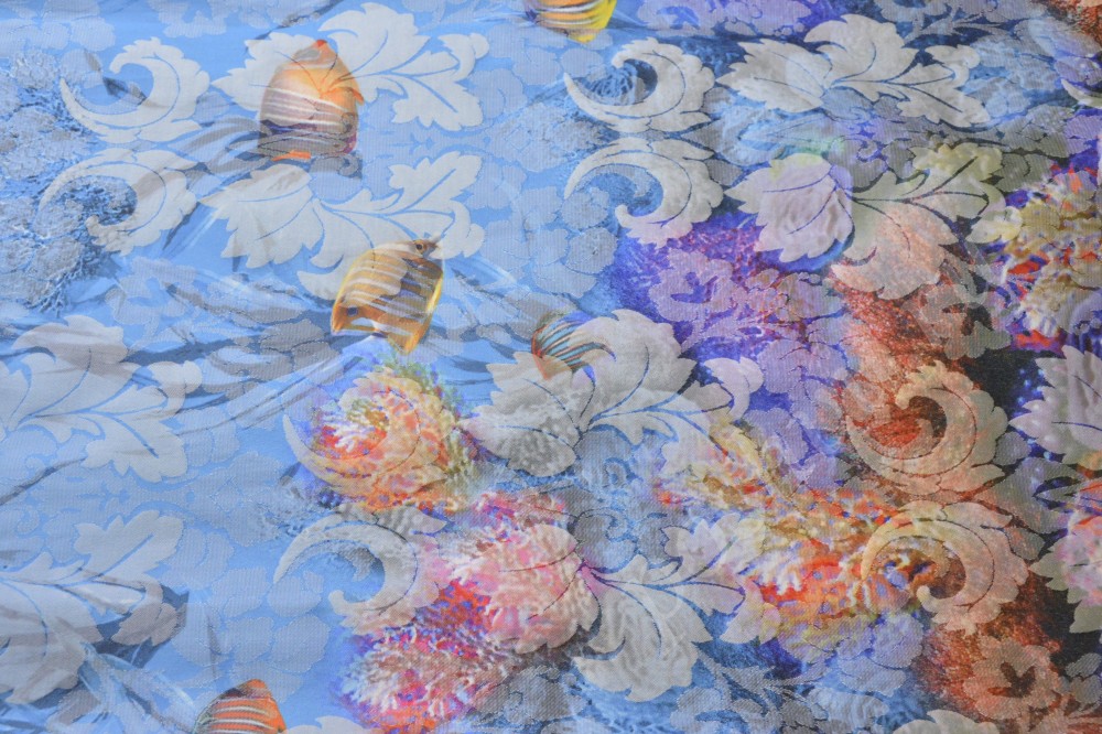 Жаккардовая ткань голубого оттенка с рыбками