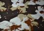 Ткань трикотаж коричневого цвета в белых и бежевых лилиях