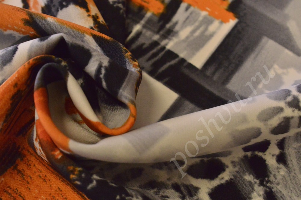 Ткань плательная белого оттенка с размытым оранжевым рисунком