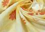 Ткань лен бело-желтого оттенка в оранжевые цветы
