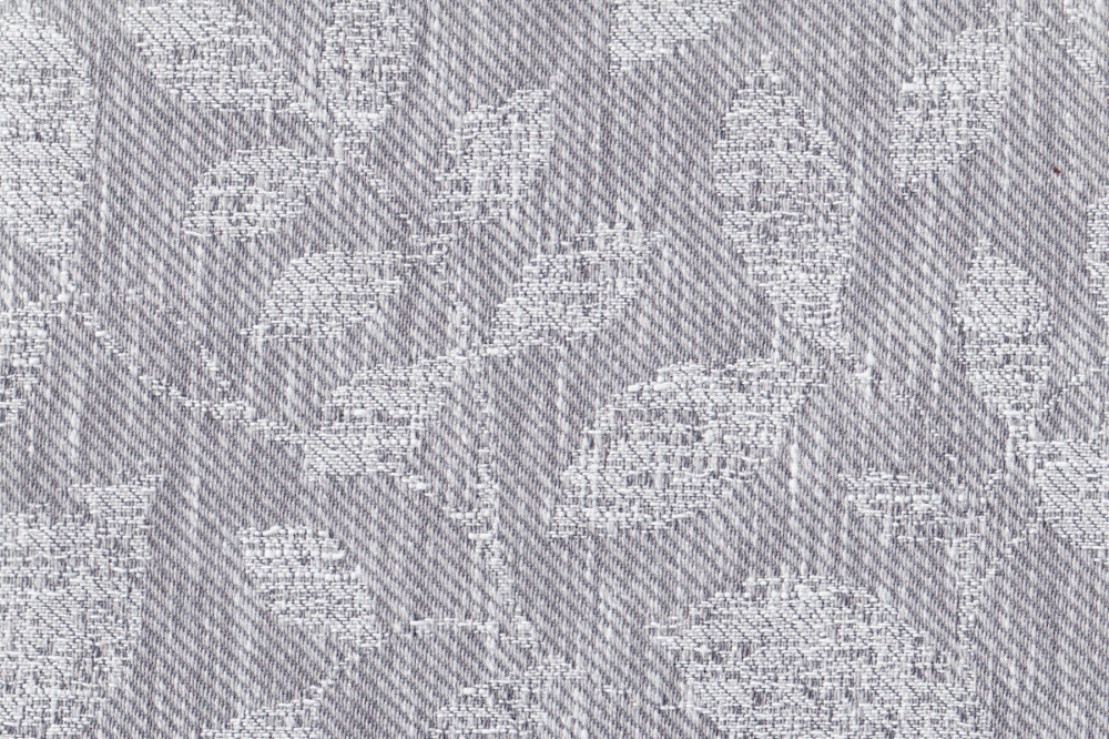 Портьерная ткань жаккард BOTANIC серого цвета с выработкой листья
