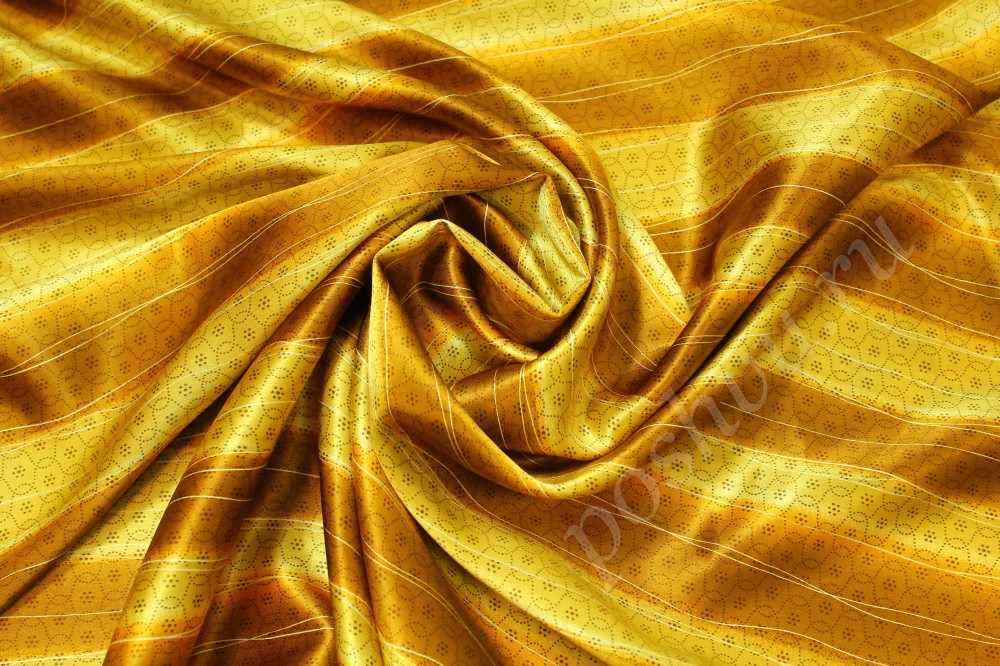 Шелковая ткань золотистого оттенка с узором