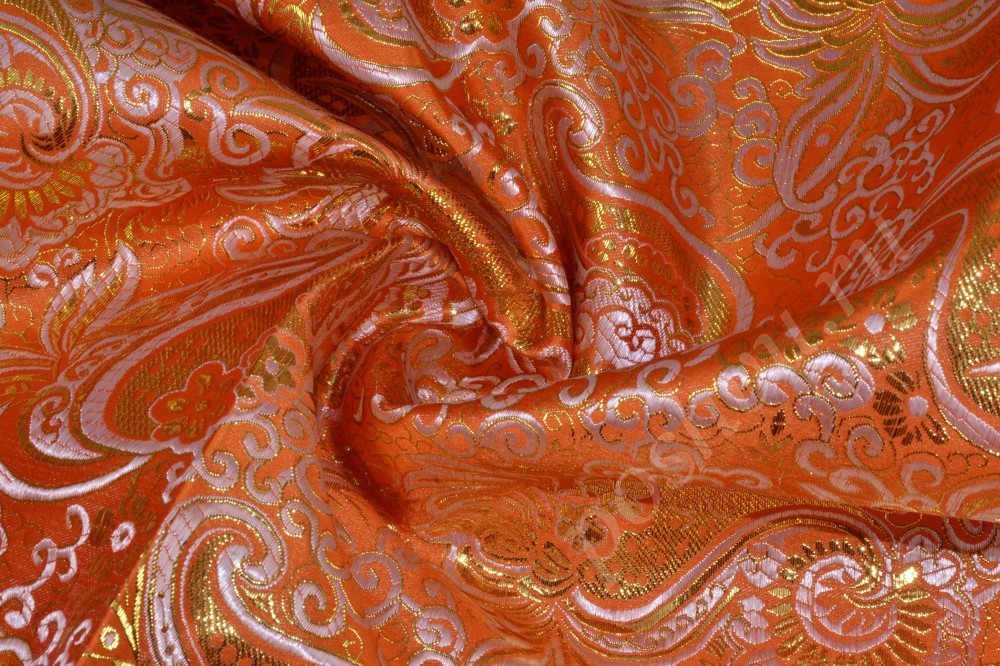 Яркая ткань парча мандаринового цвета с флористическим узором