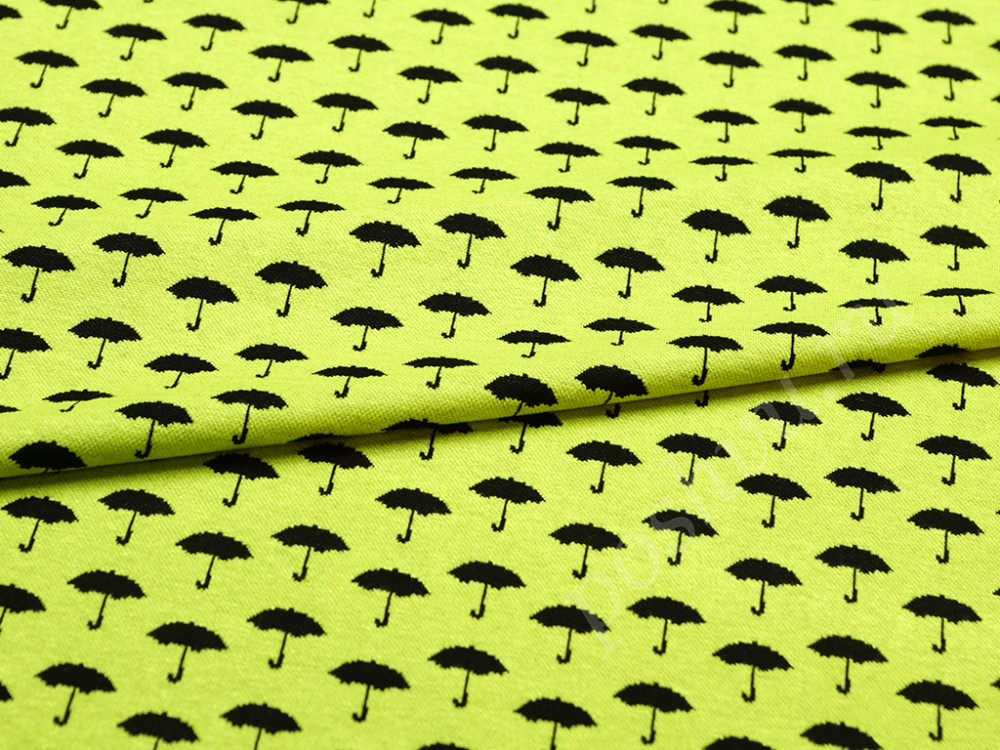 Трикотажная ткань черные зонтики на салатовом фоне
